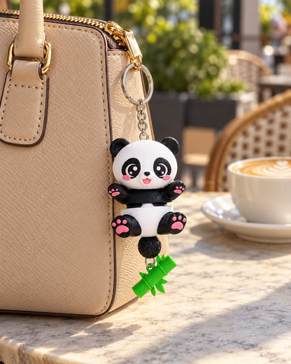 Panda keychain as a bag charm on a beige handbag zip