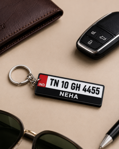 Personalised number plate keychain flat lay with car key and sunglasses